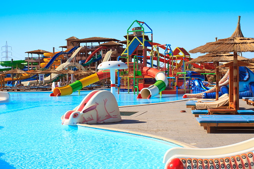 A background of a water park and a swimming pool with bright colors